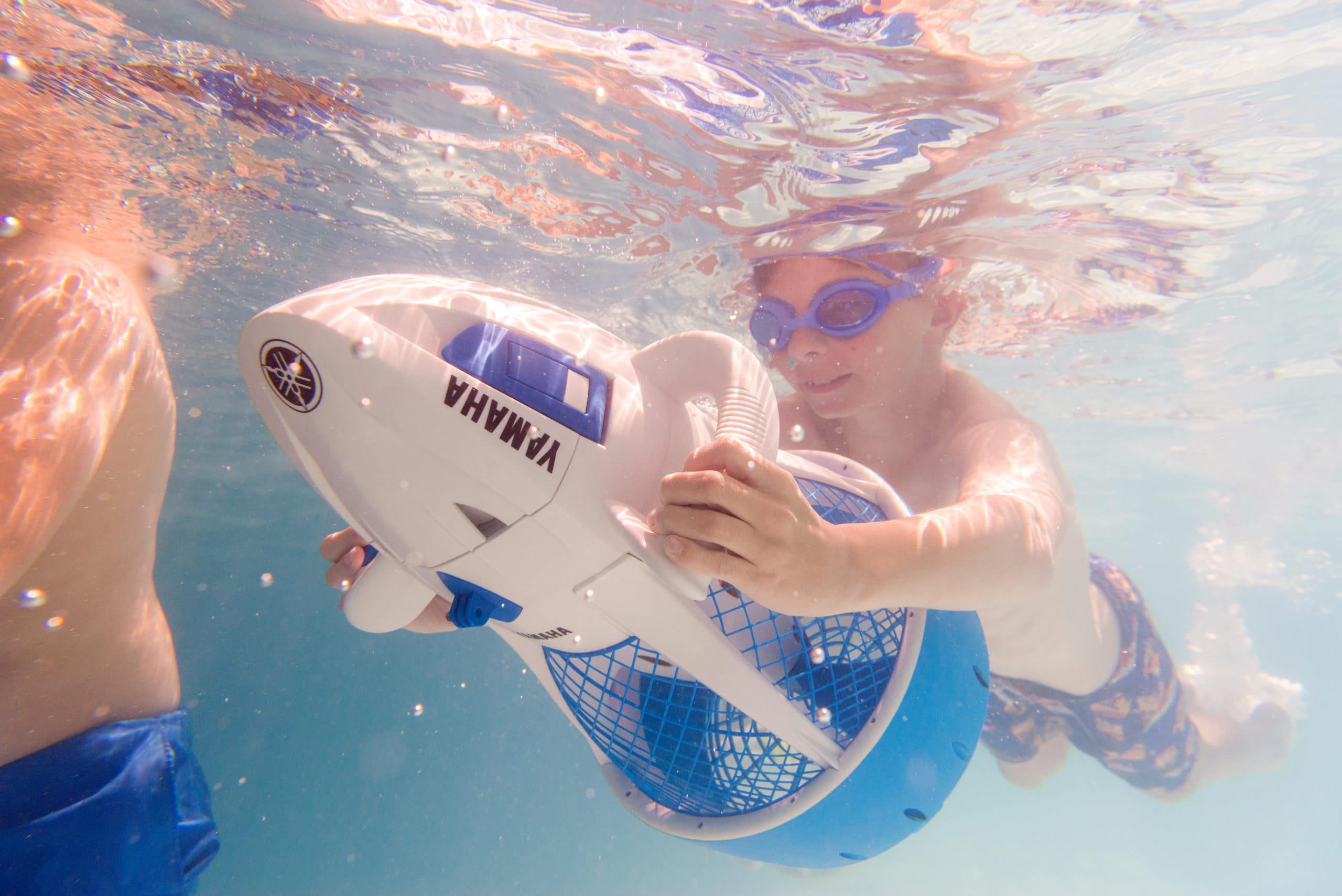 Child Underwater With Yamaha Scuba Scooter