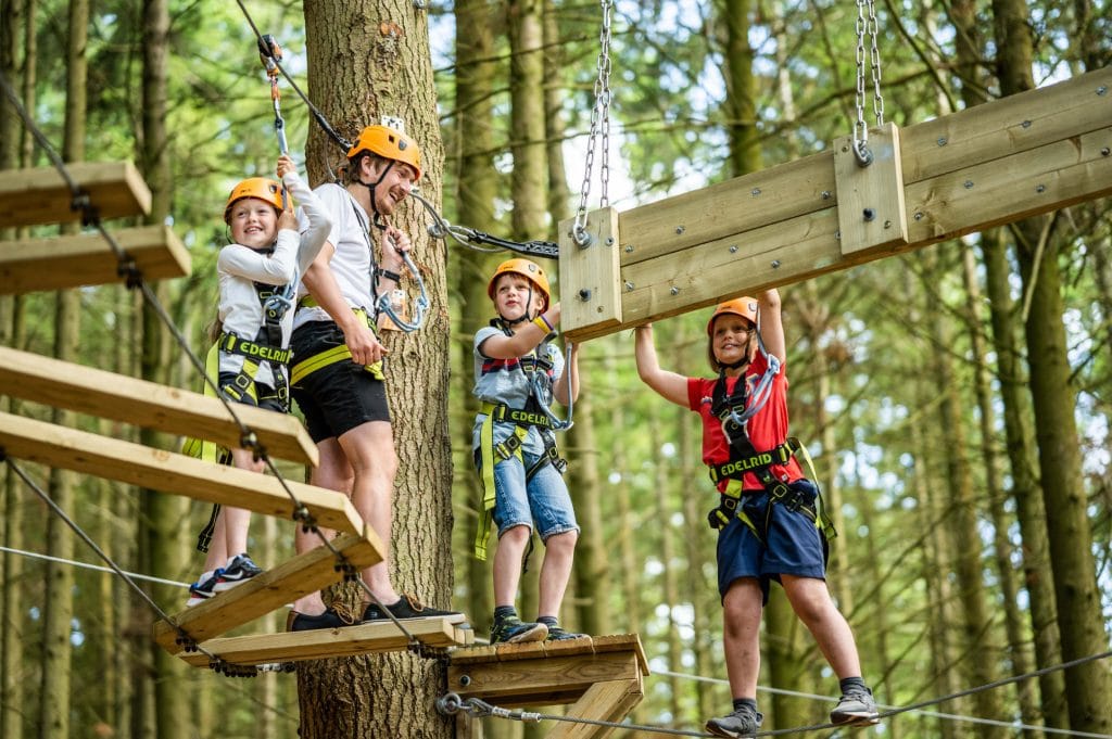 Family on High Ropes Course at Cofton Holidays