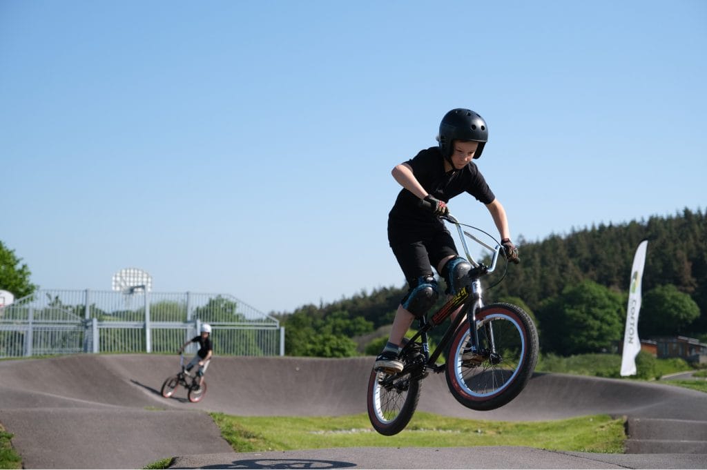 Pump track and kids with bikes at Cofton Holidays