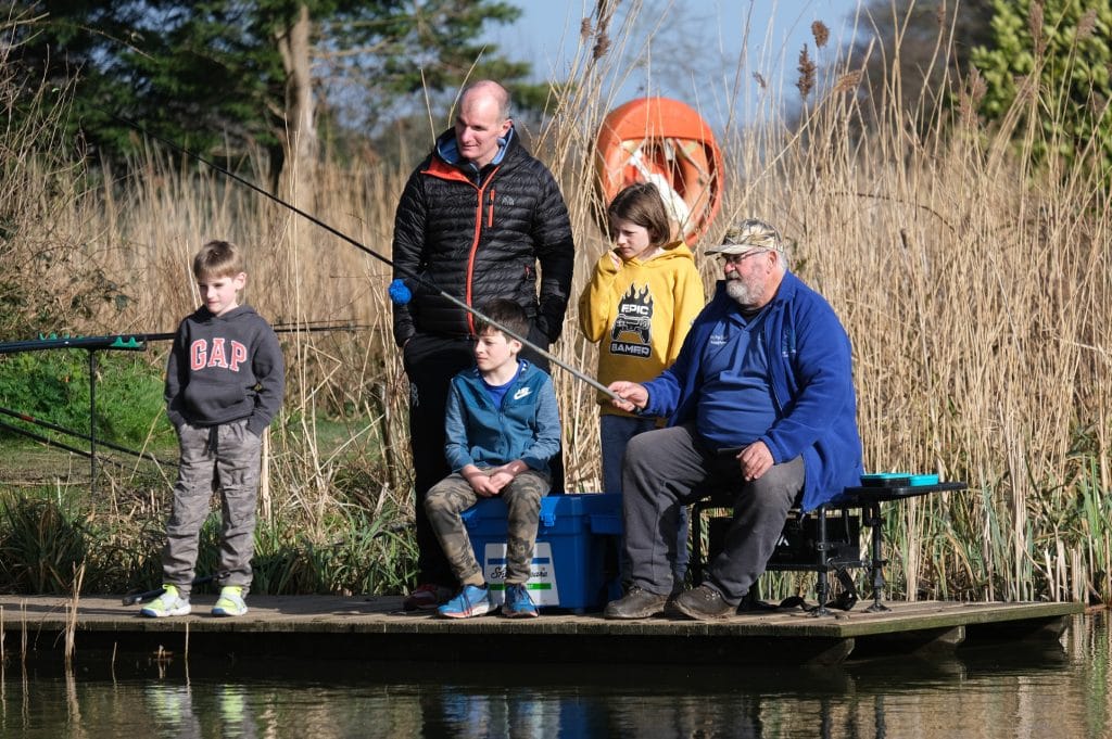 Kids try fishing activity at Cofton Holidays